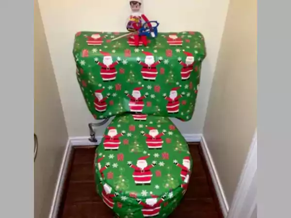 Elf is wrapping toilet pot