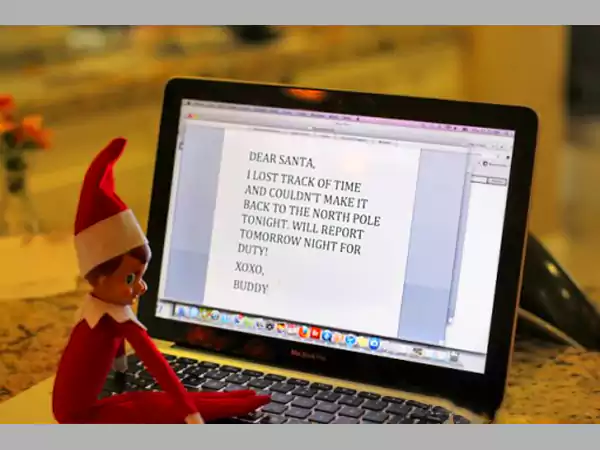 Elf is doing assignments on a laptop