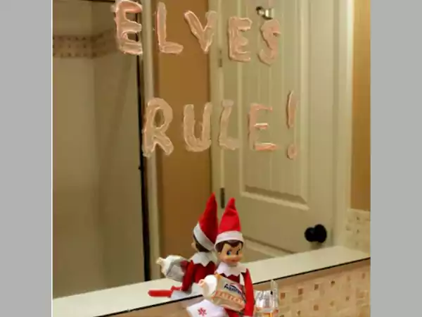 Elf is writing with toothpaste